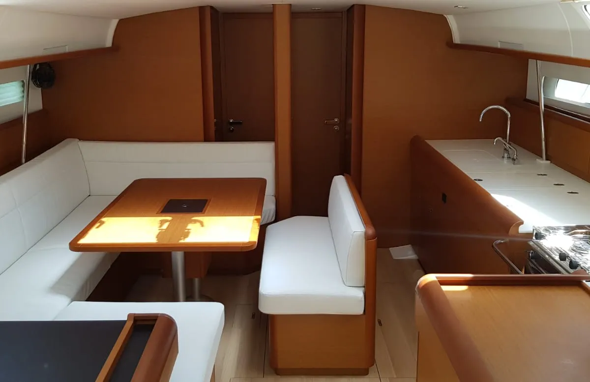 Salon of Pata, a Jeanneau Sun Odyssey 519 sailboat at Cannigione, Italy