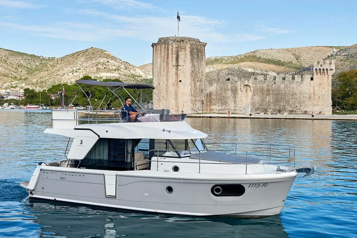 Exterior view of Odysseus, a Beneteau Swift Trawler 30 motorboat at Grad Trogir, Croatia