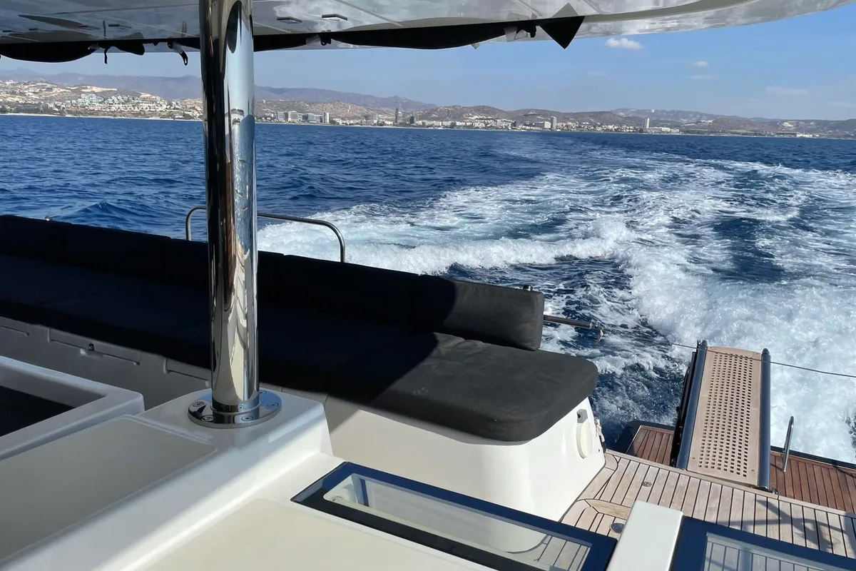 Exterior view of Pearly Gates, a Lagoon Power 630 catamaran at Mykonos, Greece