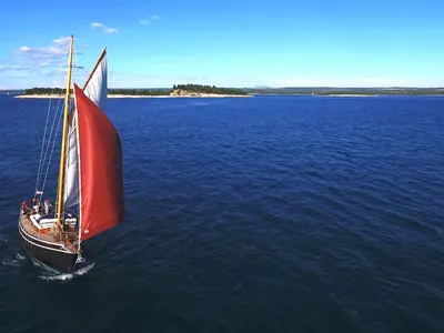 Exterior view of Black Bird, a Unknown Pilot Cutter sailboat at Pula, Croatia