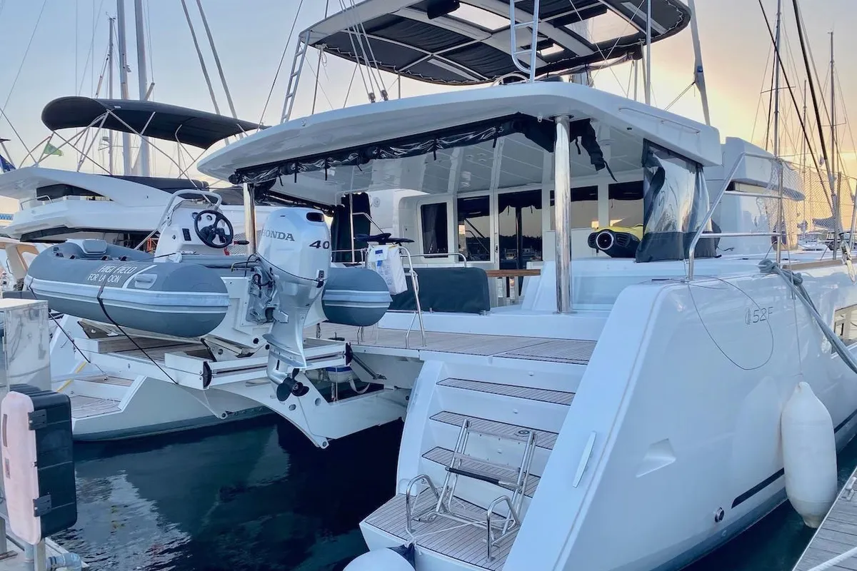 Exterior view of Jolie, a Lagoon 52F catamaran at Sant Antoni de Portmany, Spain