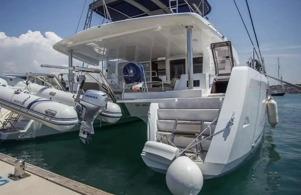 Exterior view of Jolie, a Lagoon 52F catamaran at Sant Antoni de Portmany, Spain