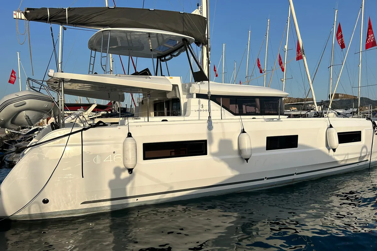 Exterior view of PEIKEA, a Lagoon 46 catamaran at Sant Antoni de Portmany, Spain