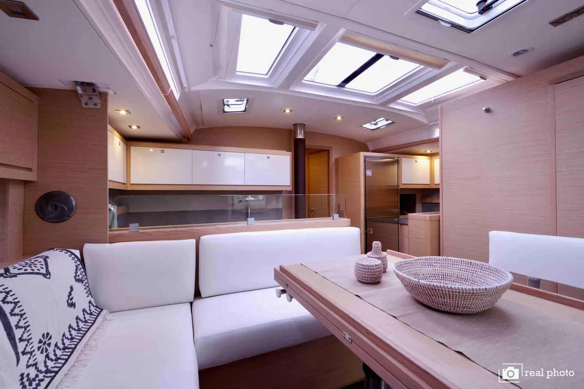 Salon of Cassiopea - A/C, Generator, Water maker, Solar Panel, a Dufour 530 sailboat at Olbia, Italy