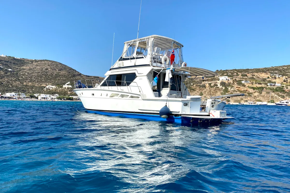 Exterior view of Tipejyas, a Gulet Hatteras 50 Convertible motorboat at Athens, Greece