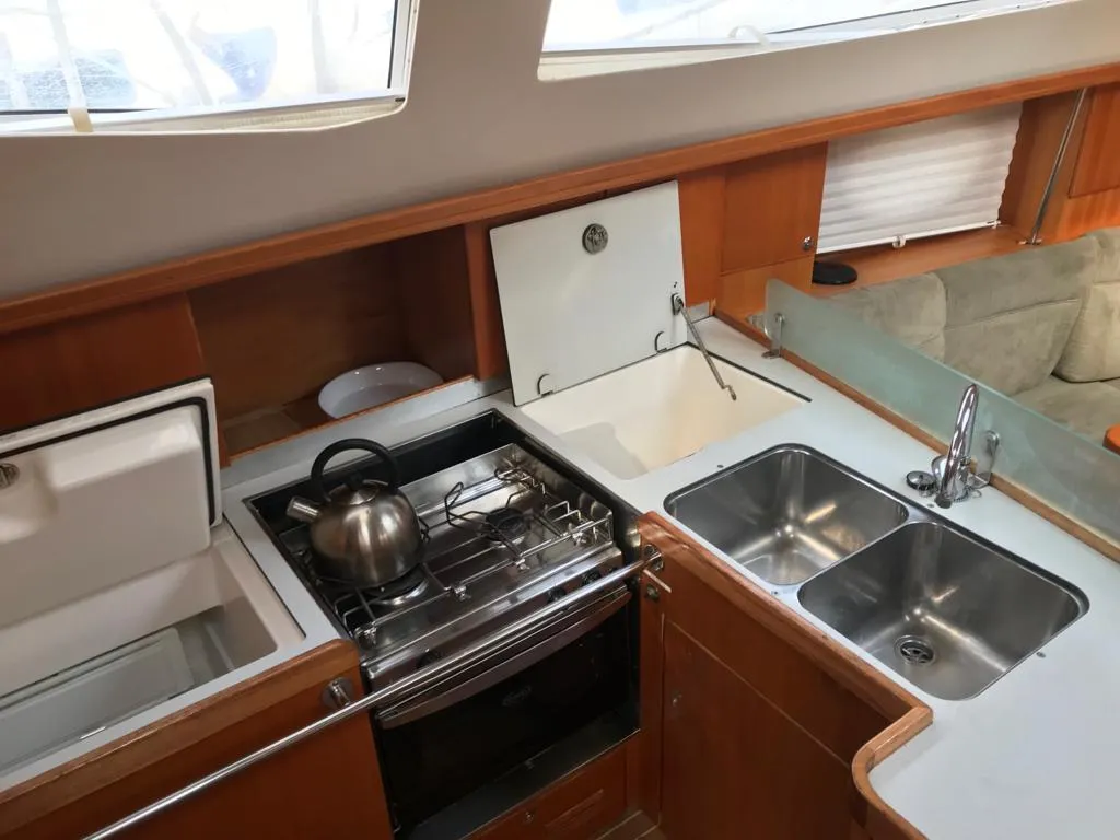 Galley of Alboran XXIV Cocomaluco, a Elan Impression 434 sailboat at es Jonquet, Spain