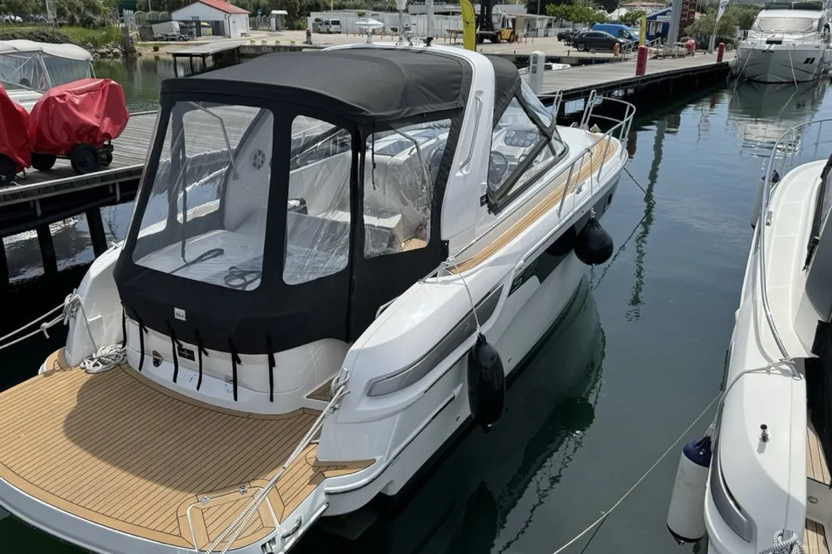 Exterior view of Elvie, a Bavaria S29 motorboat at Punat, Croatia