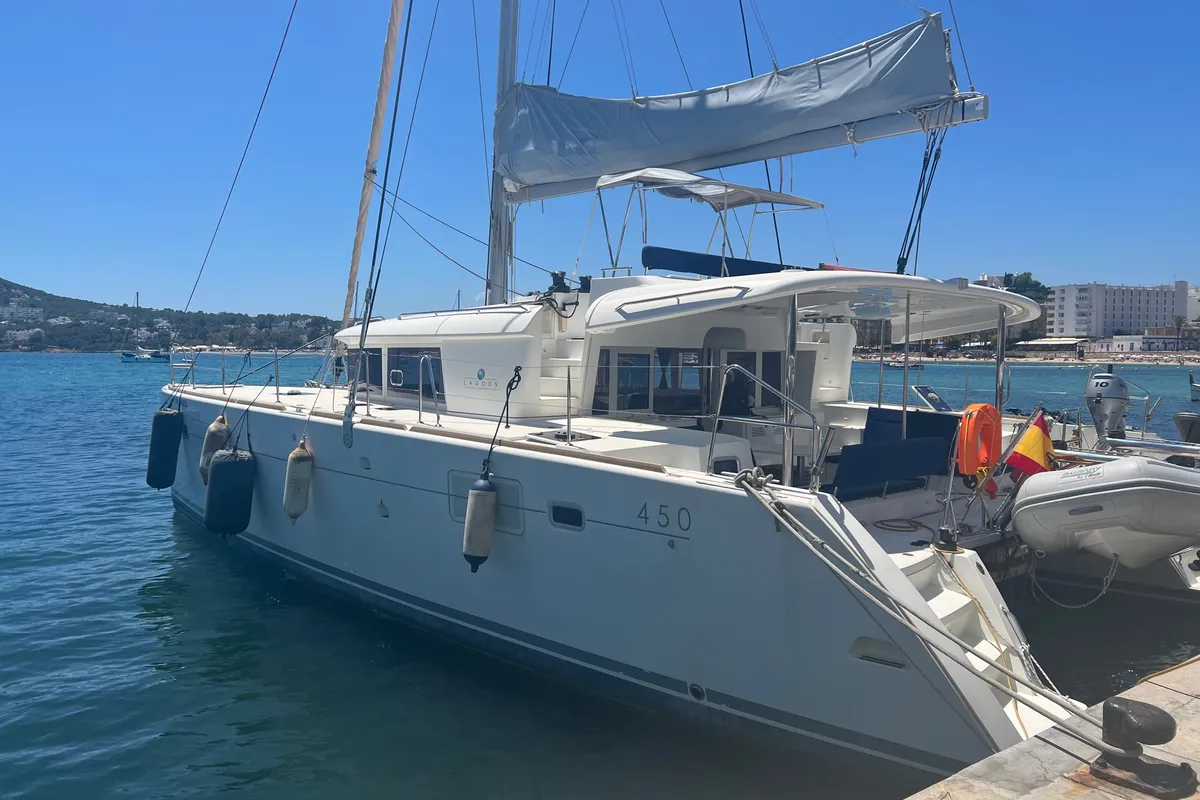Exterior view of Ocean Mares, a Lagoon 450 Fly catamaran at Sant Antoni de Portmany, Spain
